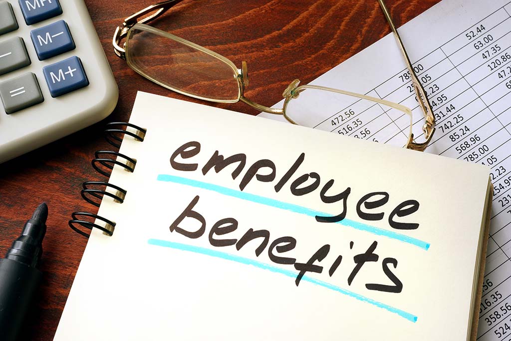 Employee benefits written on a notepad. Business concept. family planning at chcw